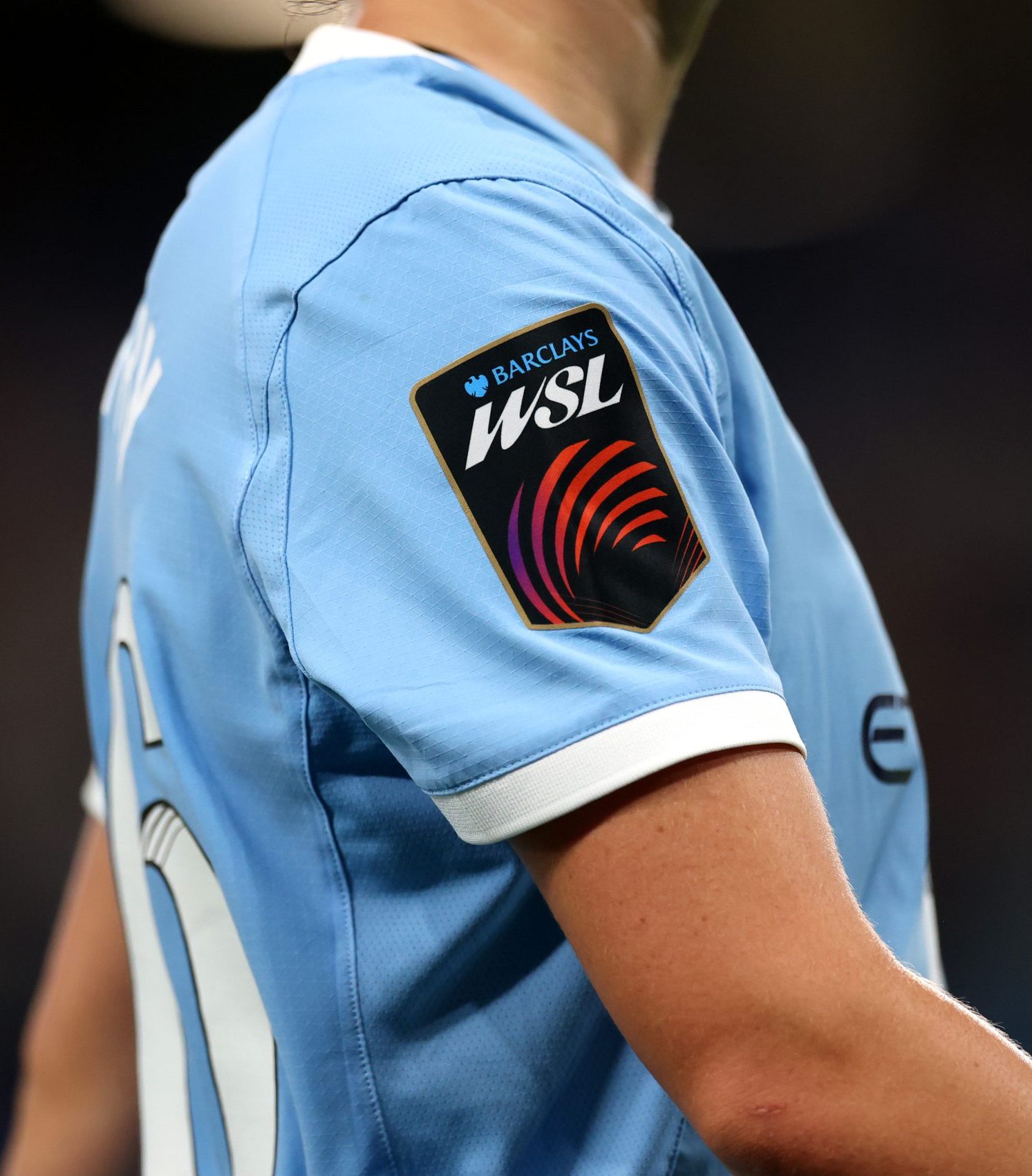 Close up of a WSL badge from ID UNLIMITED UK