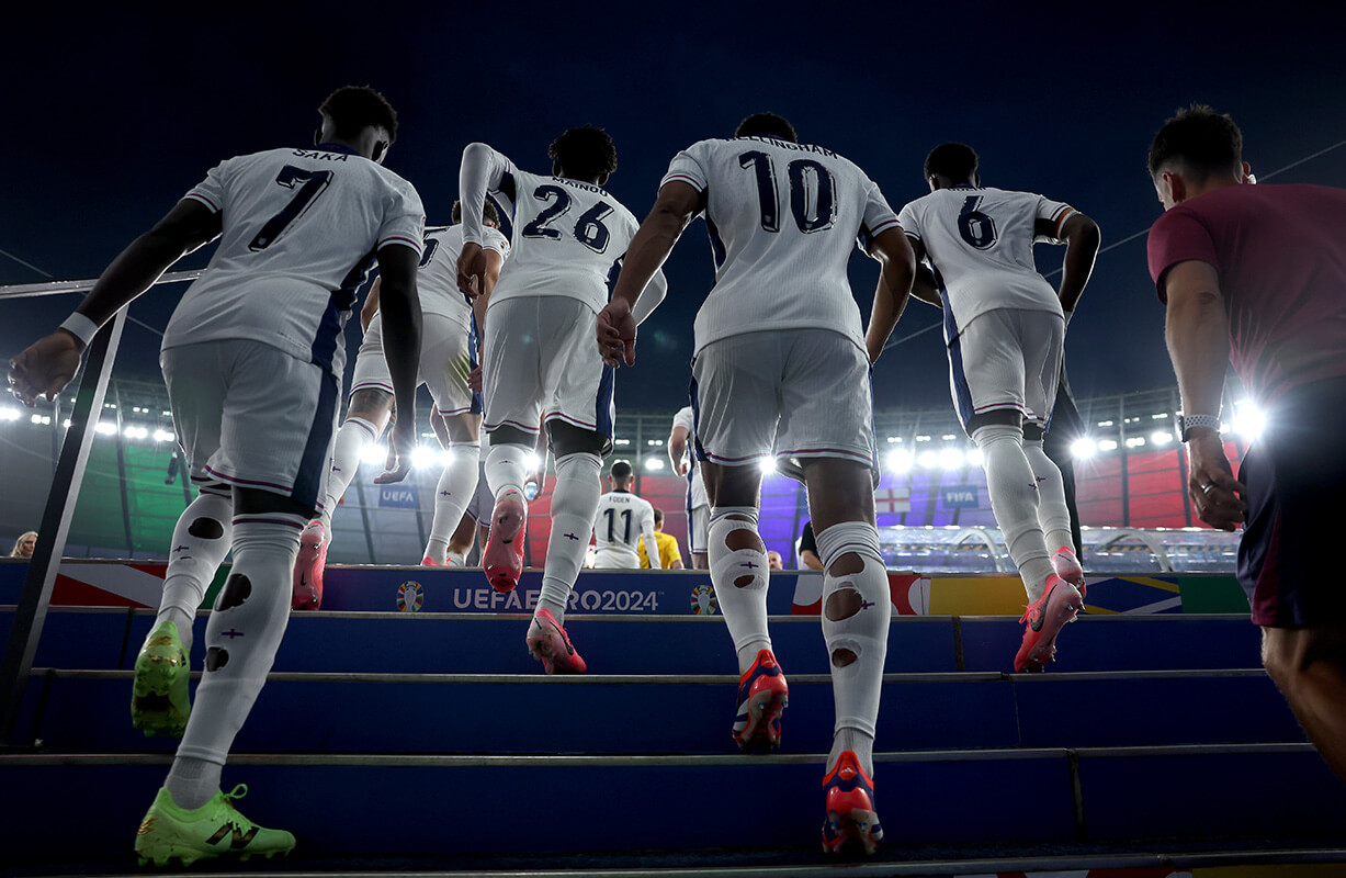 Image showing a number of England players climbing the stairs of a stadium