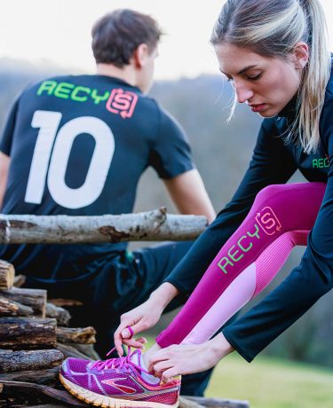 Image showing two models wearing RECYS branded sports gear