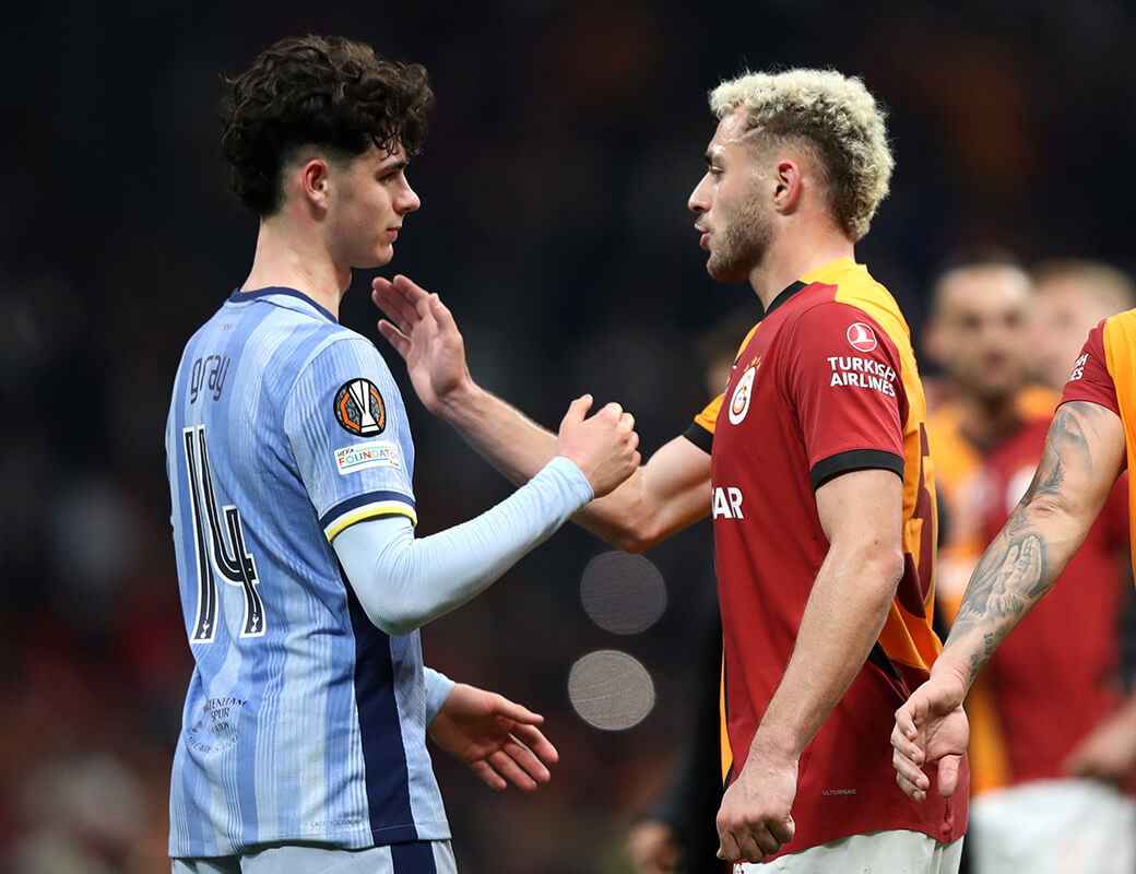 Image showing Archie Gray shaking hands with a player with the Europa League badge on his sleeve